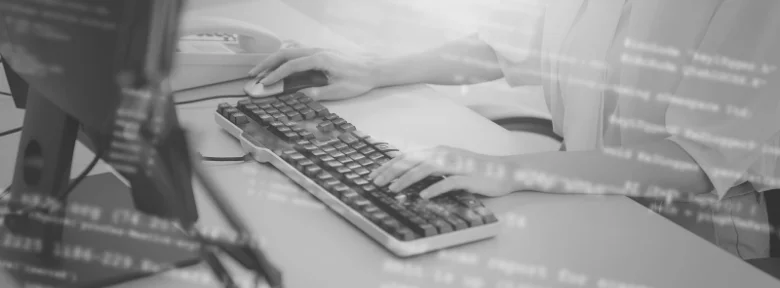 A closeup of hands on a mouse and keyboard