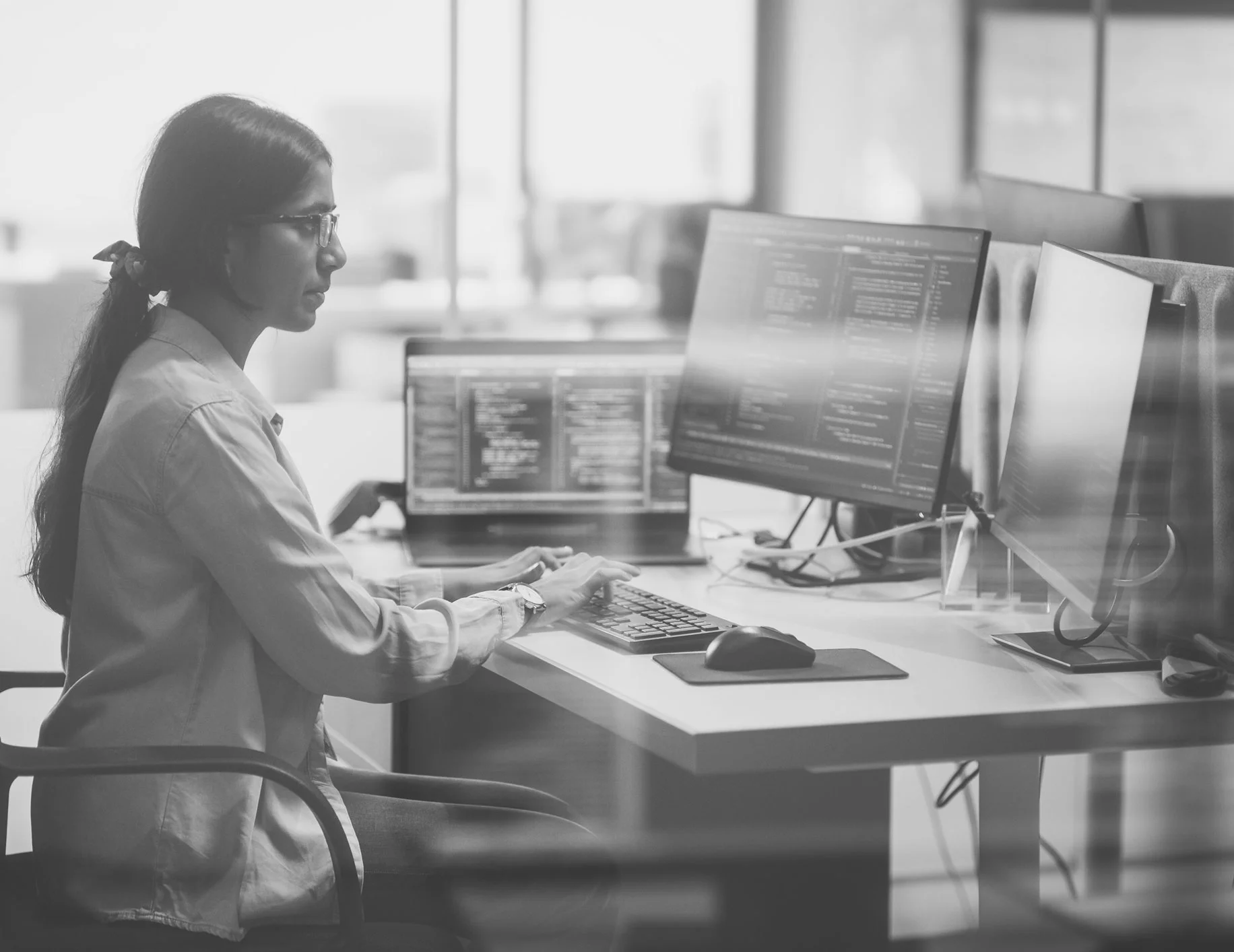 A person types at a computer