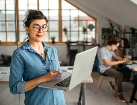 A person holding a laptop