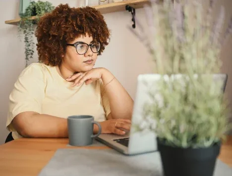 An image of a woman at her computer