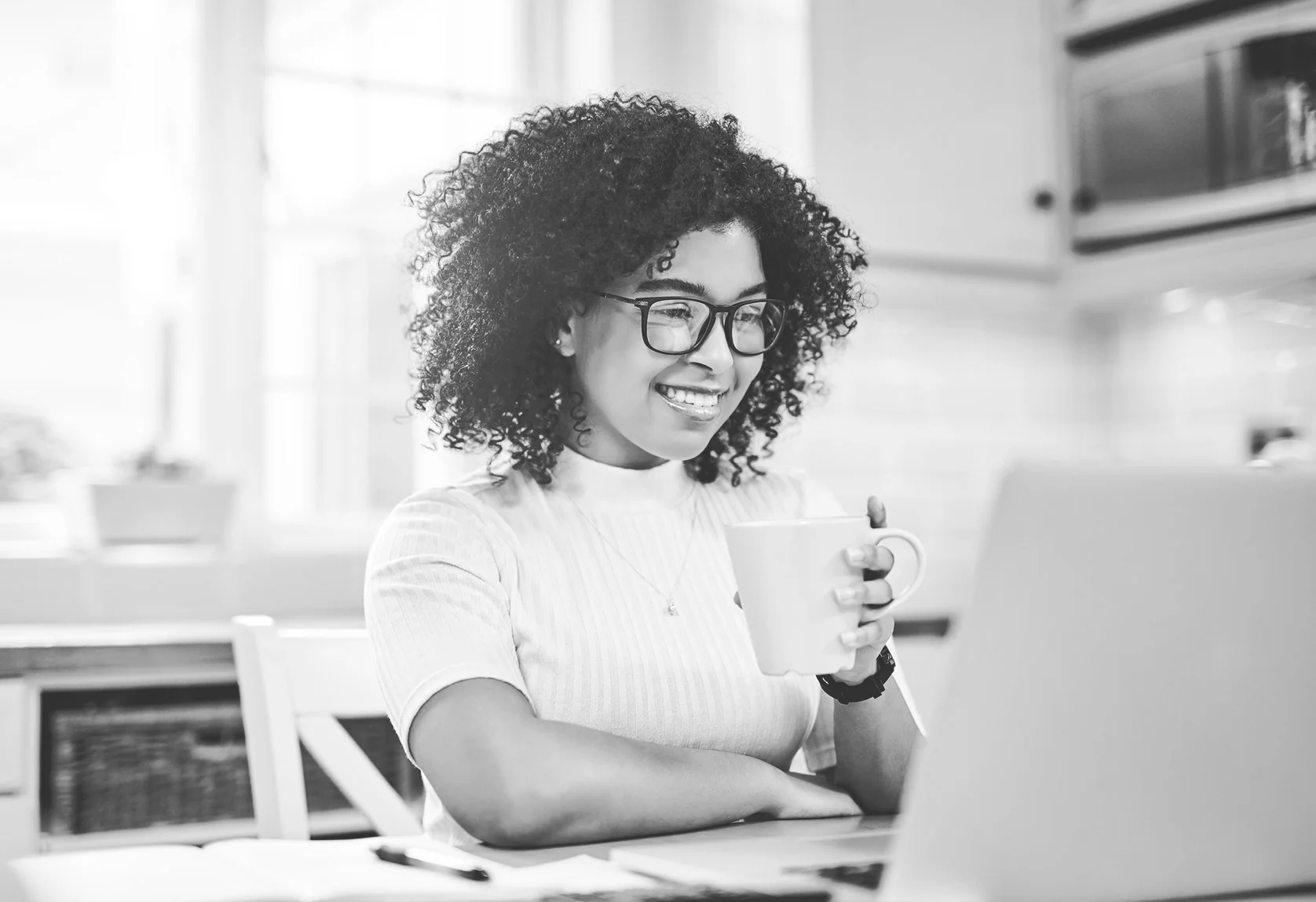 An image of a woman at her computer